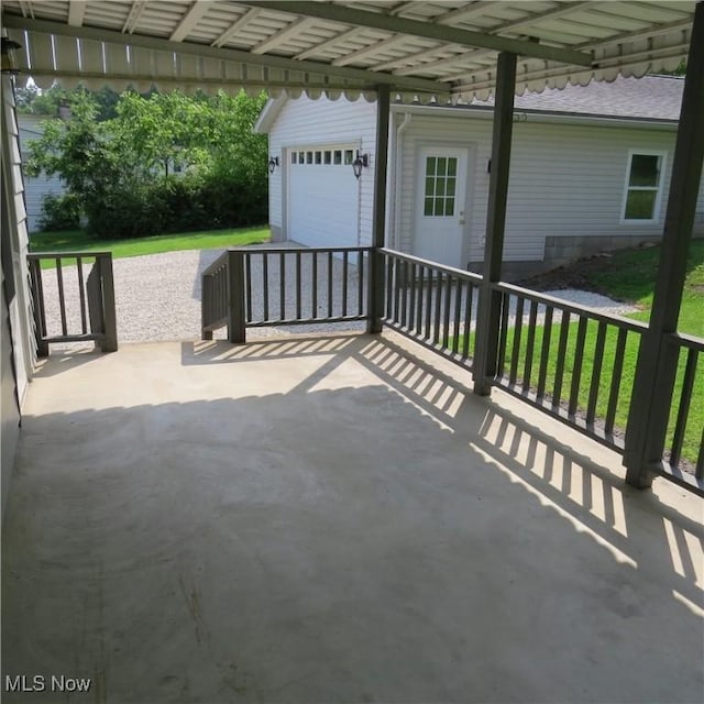 399 N Main St, Amsterdam, OH 43903 - view of patio with a garage and an outdoor structure