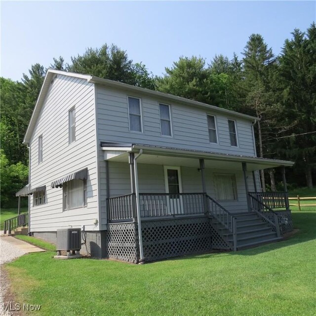 399 N Main St, Amsterdam, OH 43903 - view of front of home with a porch, a front lawn, and stairs
