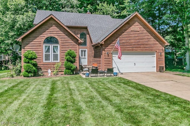 5710 Cardinal Dr, Mentor, OH 44060 - rustic home with an attached garage, driveway, roof with shingles, and a front lawn