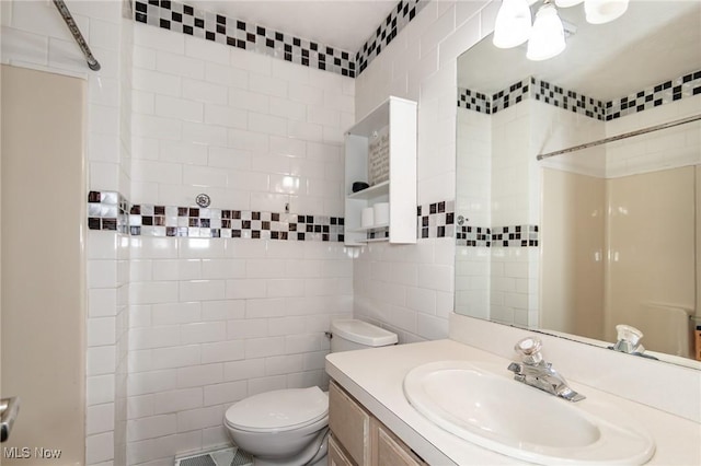 5710 Cardinal Dr, Mentor, OH 44060 - bathroom with tile walls, vanity, and a shower