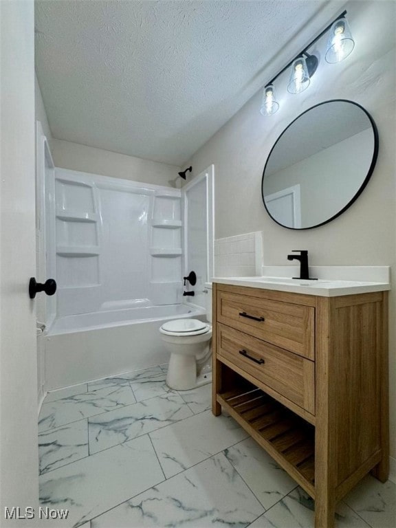 233 Kennedy St, Louisville, OH 44641 - bathroom with marble finish floors, vanity, bathing tub / shower combination, and a textured ceiling