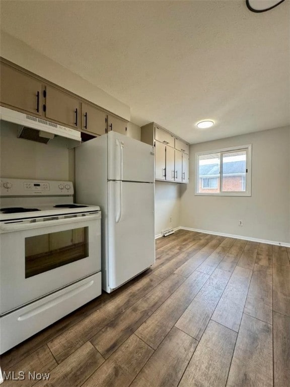 233 Kennedy St, Louisville, OH 44641 - kitchen featuring white appliances, under cabinet range hood, and dark wood-style flooring