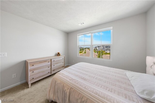 2457 Bishop Oval, Barberton, OH 44203 - bedroom with baseboards and light carpet