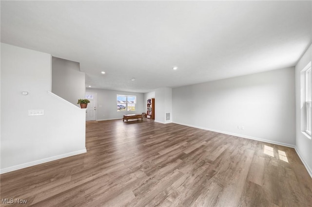 2457 Bishop Oval, Barberton, OH 44203 - unfurnished living room with wood finished floors and recessed lighting
