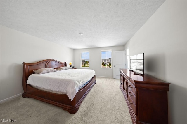 2457 Bishop Oval, Barberton, OH 44203 - bedroom featuring light colored carpet and a textured ceiling