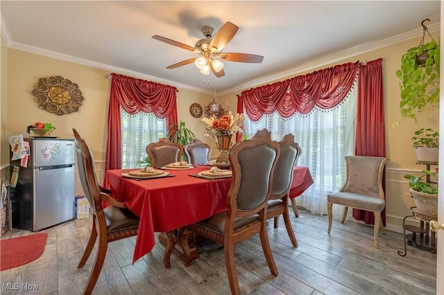 1201 Overlook Dr, Alliance, OH 44601 - dining room featuring ornamental molding, light wood-style flooring, and ceiling fan