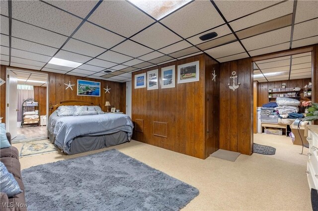 1201 Overlook Dr, Alliance, OH 44601 - bedroom with wood walls, carpet floors, and a drop ceiling