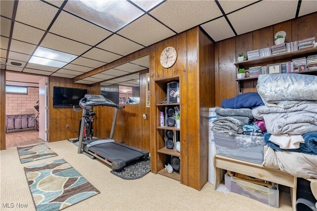1201 Overlook Dr, Alliance, OH 44601 - workout room featuring wooden walls, carpet, and a paneled ceiling