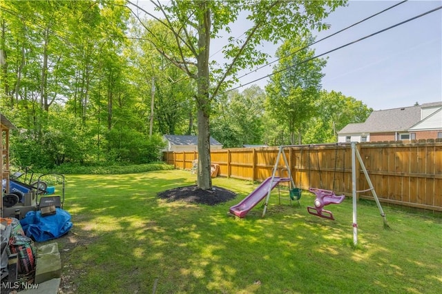 1201 Overlook Dr, Alliance, OH 44601 - fenced backyard featuring a playground