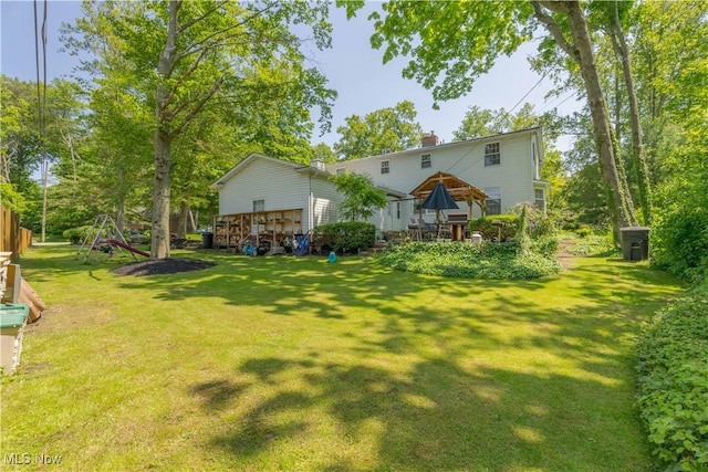 1201 Overlook Dr, Alliance, OH 44601 - rear view of property with a yard, a chimney, a gazebo, and a wooden deck