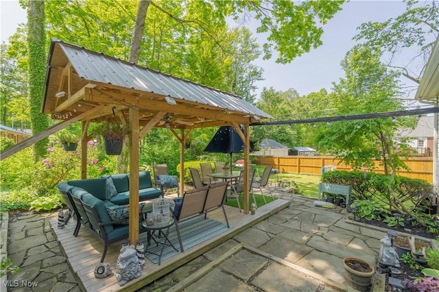 1201 Overlook Dr, Alliance, OH 44601 - fenced backyard featuring an outdoor hangout area, a patio, a gazebo, and outdoor dining space