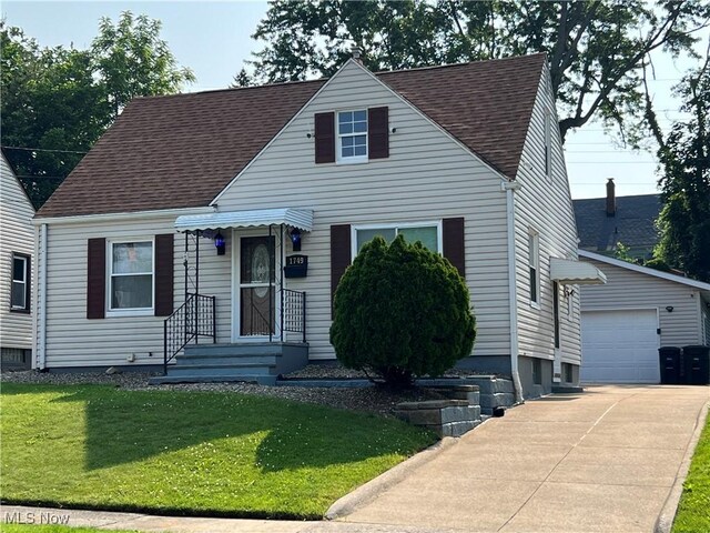 1749 Highview Ave, Akron, OH 44301 - cape cod-style house with roof with shingles and a front lawn