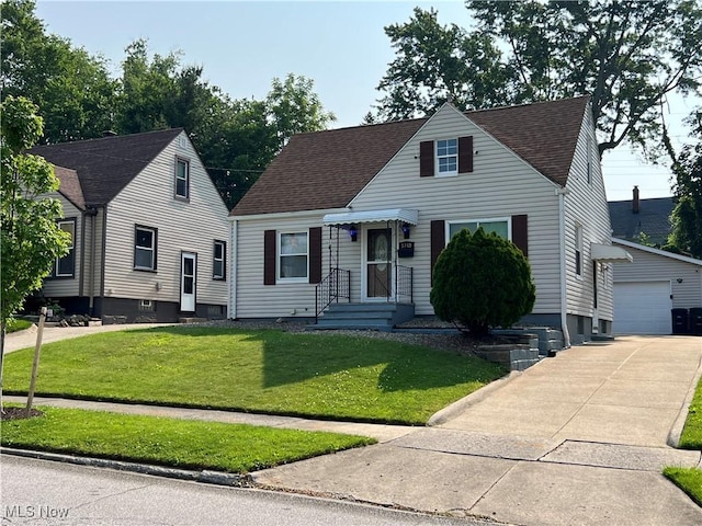 1749 Highview Ave, Akron, OH 44301 - view of front of home featuring a front lawn, a shingled roof, and a detached garage