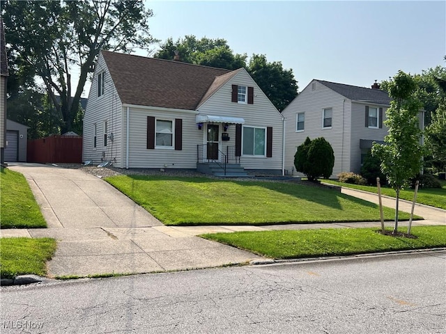 1749 Highview Ave, Akron, OH 44301 - view of front of house featuring a shingled roof and a chimney