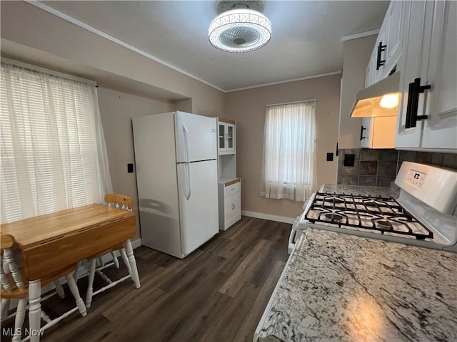 1749 Highview Ave, Akron, OH 44301 - kitchen with white appliances, crown molding, dark wood-type flooring, backsplash, and extractor fan