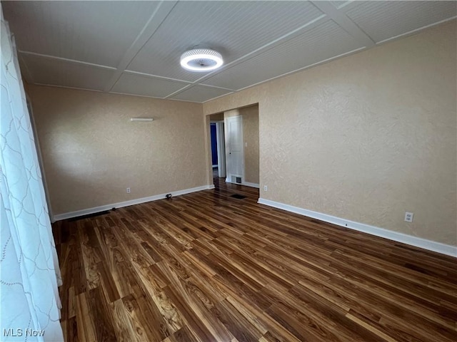 1749 Highview Ave, Akron, OH 44301 - spare room featuring dark wood-type flooring and a textured wall