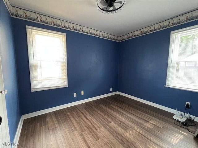 1749 Highview Ave, Akron, OH 44301 - spare room featuring dark wood-style flooring