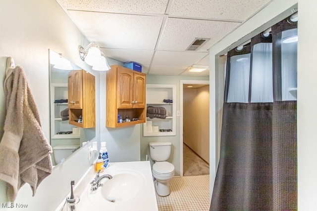 1805 Lealand Ave, Poland, OH 44514 - bathroom with a paneled ceiling, built in features, tile patterned flooring, vanity, and curtained shower
