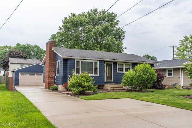 1805 Lealand Ave, Poland, OH 44514 - view of front facade featuring an outdoor structure, a garage, a front yard, a chimney, and concrete driveway