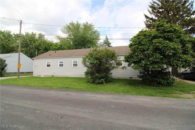 335 Superior Ct, Port Clinton, OH 43452 - view of home's exterior featuring crawl space and a lawn