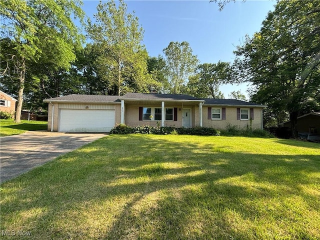 1312 Glennview St NE, Canton, OH 44721 - single story home with an attached garage, driveway, and a front lawn
