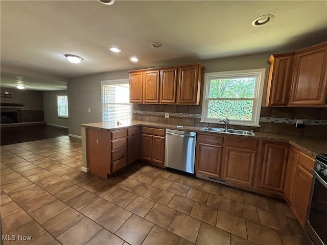 1312 Glennview St NE, Canton, OH 44721 - kitchen featuring dishwasher, a peninsula, backsplash, recessed lighting, and open floor plan