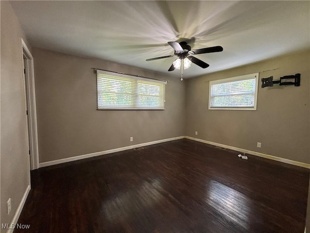 1312 Glennview St NE, Canton, OH 44721 - spare room featuring dark wood-type flooring and ceiling fan