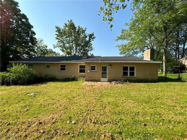 1312 Glennview St NE, Canton, OH 44721 - rear view of house with a chimney and brick siding