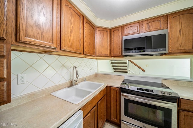 7297 Trotter Ln Unit B, Mentor, OH 44060 - kitchen with appliances with stainless steel finishes and brown cabinetry