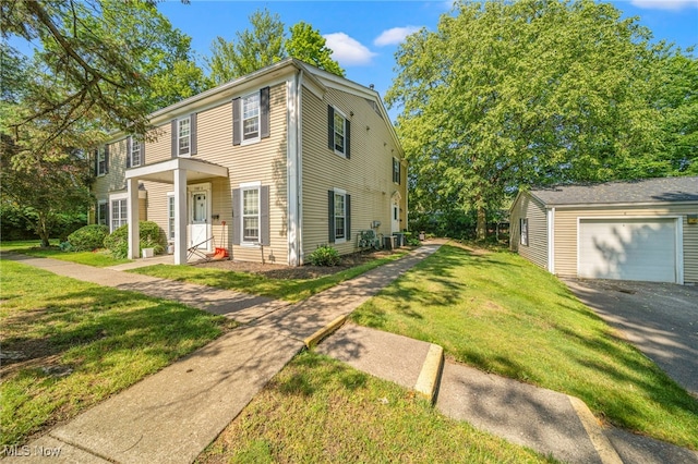 7297 Trotter Ln Unit B, Mentor, OH 44060 - colonial inspired home with a front lawn, a garage, an outdoor structure, and asphalt driveway