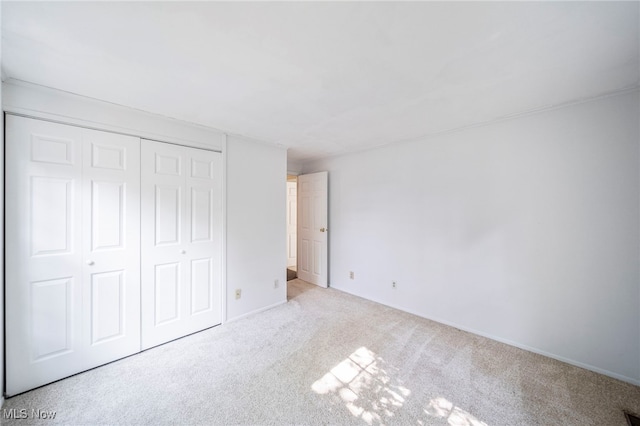 7297 Trotter Ln Unit B, Mentor, OH 44060 - unfurnished bedroom featuring carpet flooring and a closet