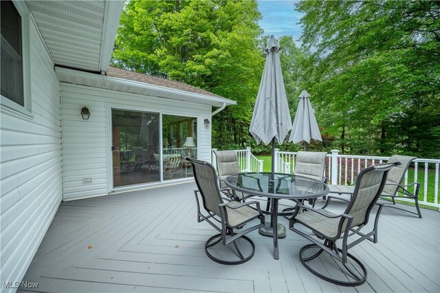6685 Elwood St, Austintown, OH 44515 - wooden deck with outdoor dining area