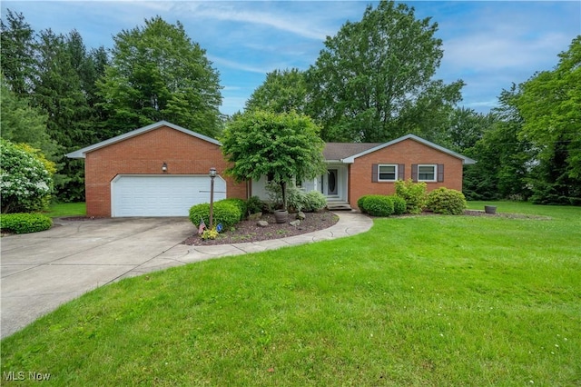 6685 Elwood St, Austintown, OH 44515 - ranch-style house featuring driveway, a front lawn, and a garage