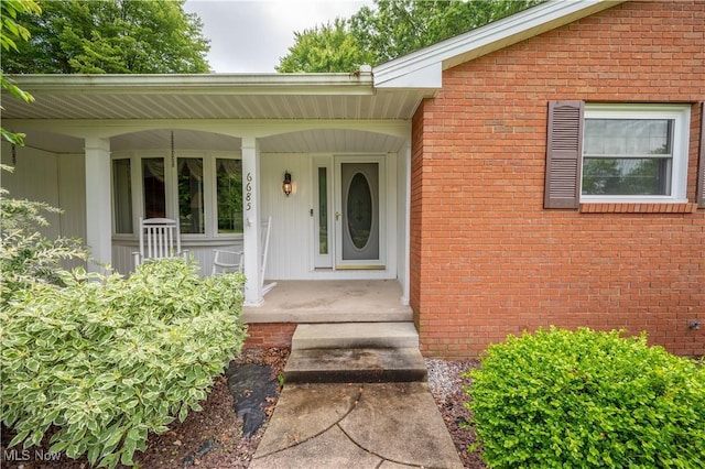 6685 Elwood St, Austintown, OH 44515 - entrance to property with covered porch and brick siding