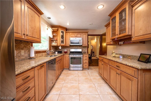 6685 Elwood St, Austintown, OH 44515 - kitchen featuring stainless steel appliances, tasteful backsplash, light stone counters, light tile patterned flooring, and recessed lighting