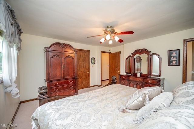 6685 Elwood St, Austintown, OH 44515 - bedroom with light carpet and a ceiling fan