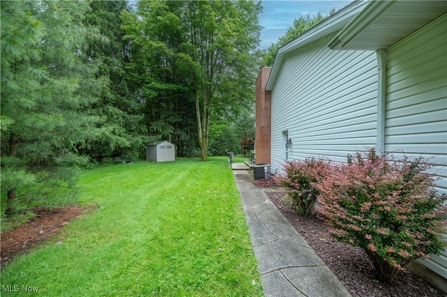 6685 Elwood St, Austintown, OH 44515 - view of green lawn featuring a storage unit