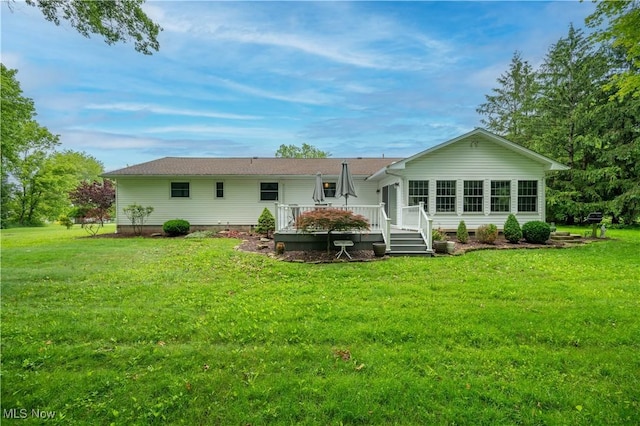 6685 Elwood St, Austintown, OH 44515 - back of house with a wooden deck, a yard, and crawl space