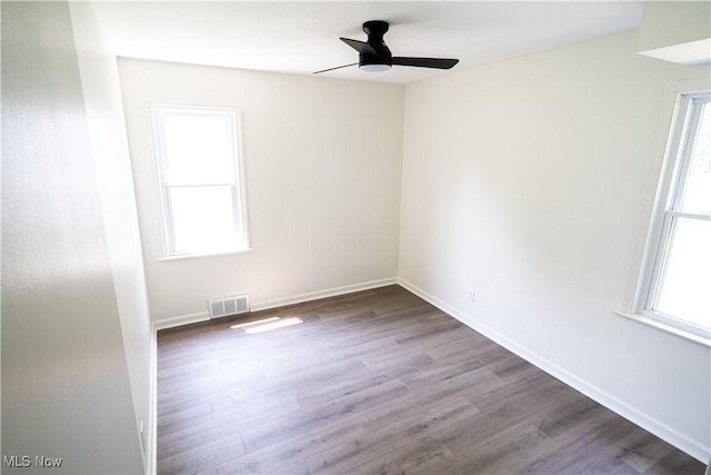 6580 Crossview Rd, Seven Hills, OH 44131 - empty room with healthy amount of natural light, wood finished floors, and ceiling fan