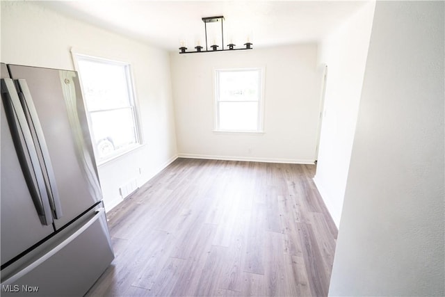 6580 Crossview Rd, Seven Hills, OH 44131 - unfurnished dining area with wood finished floors and baseboards