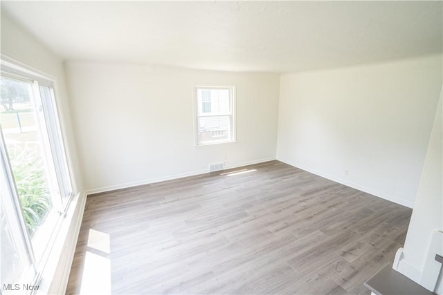 6580 Crossview Rd, Seven Hills, OH 44131 - empty room featuring healthy amount of natural light and wood finished floors