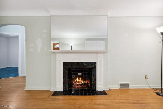 16200 Elsienna Ave, Cleveland, OH 44135 - detailed view of a fireplace, arched walkways, and wood finished floors