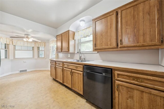 16200 Elsienna Ave, Cleveland, OH 44135 - kitchen with dishwashing machine, light countertops, brown cabinets, and a ceiling fan
