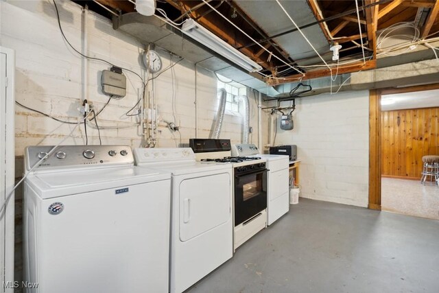 16200 Elsienna Ave, Cleveland, OH 44135 - laundry area with washing machine and clothes dryer and concrete block wall