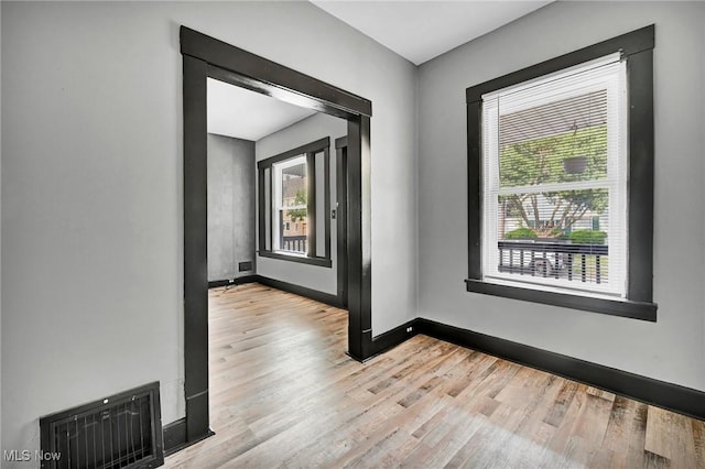 3620 E 63rd St, Cleveland, OH 44105 - unfurnished room featuring wood finished floors and baseboards
