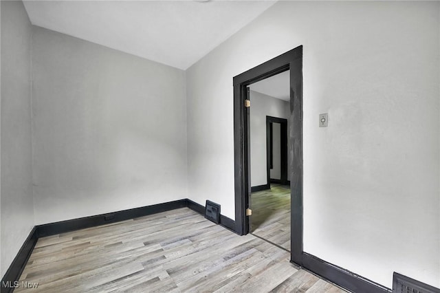 3620 E 63rd St, Cleveland, OH 44105 - empty room featuring wood finished floors and baseboards