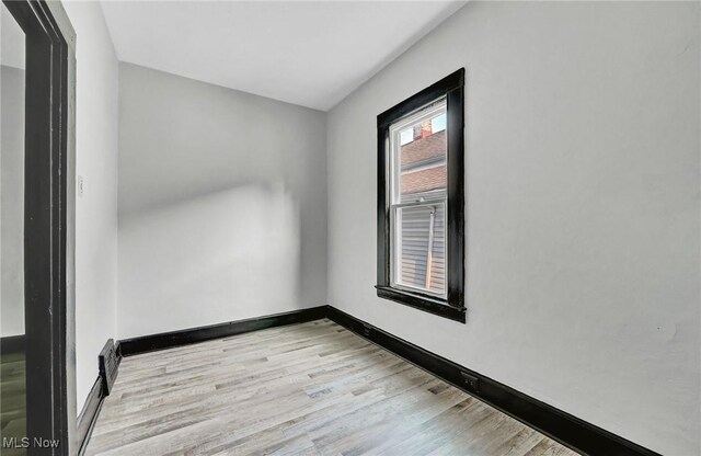 3620 E 63rd St, Cleveland, OH 44105 - unfurnished room featuring light wood finished floors and baseboards