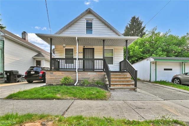 3620 E 63rd St, Cleveland, OH 44105 - view of front of property with covered porch and an outbuilding