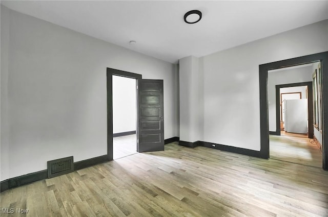 3620 E 63rd St, Cleveland, OH 44105 - empty room with light wood finished floors and baseboards