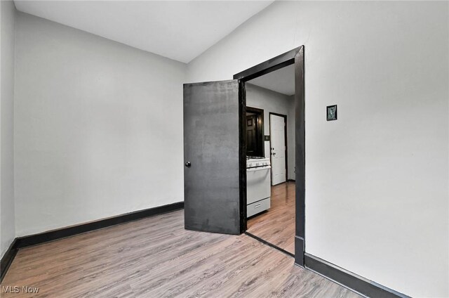 3620 E 63rd St, Cleveland, OH 44105 - empty room featuring wood finished floors and lofted ceiling